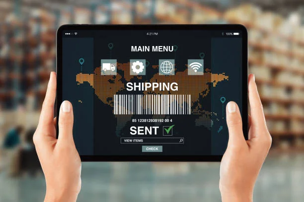 Hands holding a tablet displaying a logistics tracking app