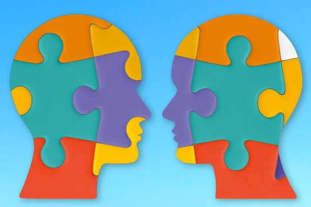 Two Colorful Puzzle Piece Heads
